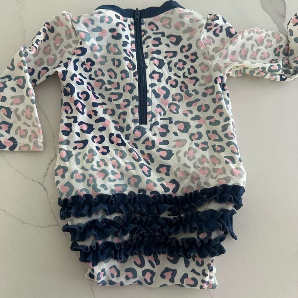 Rufflebutts Leopard Print Baby Swimsuit with snap closure and back zipper